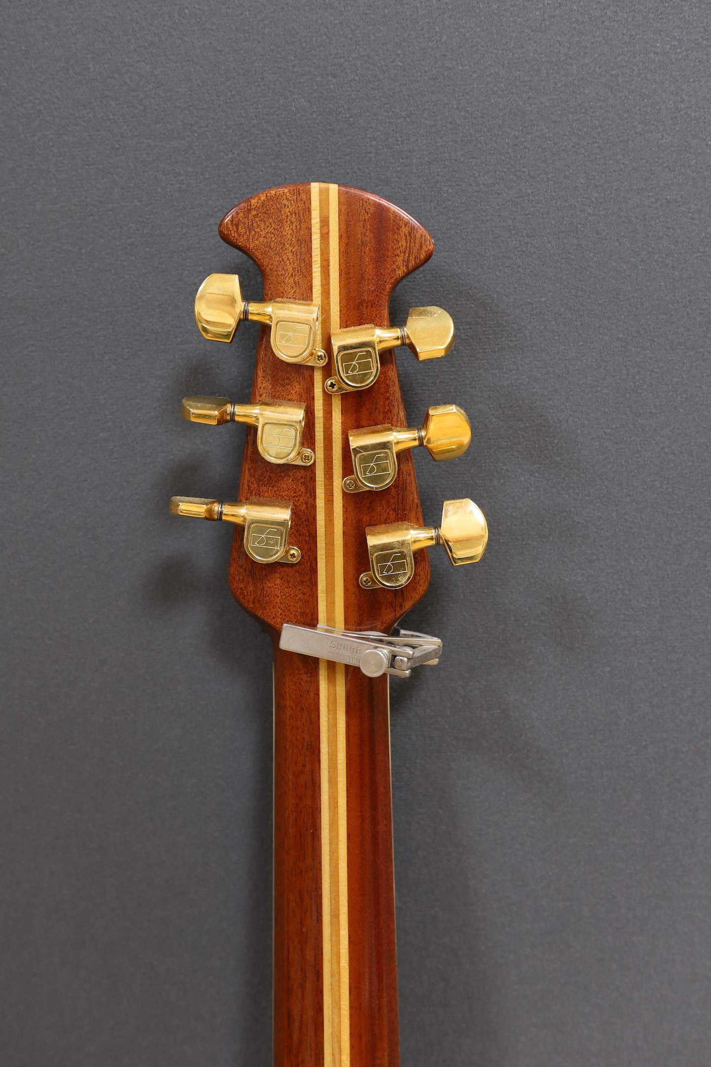 An Ovation acoustic guitar in case